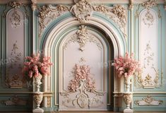 two vases filled with pink flowers sitting on top of a wooden floor next to a wall