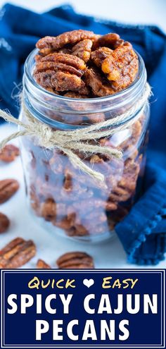 a jar full of spicy cajun pecans with text overlay reading quick easy spicy cajun pecans