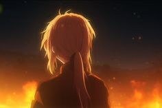 a woman with blonde hair standing in front of a fire filled sky and looking off into the distance