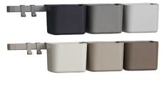 an assortment of different colors and sizes of toilet paper dispensers on a white background