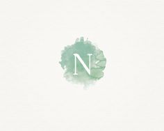 the letter n is made up of green watercolors and has a white background