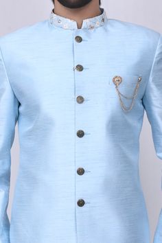 Sky blue sherwani with embroidered mandarin collar and patch pocket. Paired with pant.
Components:2
Neckline:Mandarin
Sleeve Length:Full Sleeves
Fabric:Art Silk
Color:Blue
Other Details:
Patch pocket
Note: Brooch, head accessory worn by the model is not for sale
Occasion:Wedding - Aza Fashions Blue Long Sleeve Traditional Wear For Groom, Blue Sherwani For Groom Diwali Occasion, Blue Sherwani For Groom At Eid, Blue Bandhgala For Groom On Eid, Blue Bandhgala For Groom At Eid, Blue Bandhgala For Groom At Festivals, Blue Bandhgala For Groom At Diwali, Blue Bandhgala For Grooms On Eid, Blue Nehru Jacket For Groom On Eid