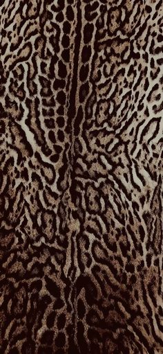 an animal print pattern is shown in brown and white