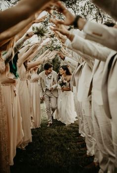 the bride and groom are walking down the aisle