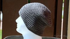 a crocheted hat sitting on top of a mannequin's head