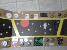 an overhead view of a space station with buttons and magnets