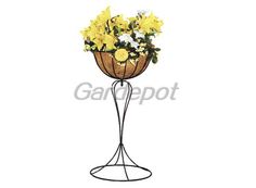 yellow and white flowers are in a basket on a metal stand with black iron legs