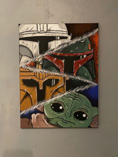 the star wars artwork is hanging on the wall