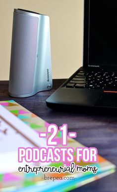 an open laptop computer sitting on top of a desk next to a notebook and mouse