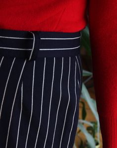 Beautiful vintage skirt made of pure wool. Long, midi high waisted cut. Navy blue color with pattern of white pinstripes. Zipper and button closure, belt loops. Row of buttons on the front. Lined. Era: 80's, Italy Fabric: 100% wool Condition: perfect, looks unworn Estimated size: L / XL (please, check the measurements) Measurements (measured flat): Waist: 42 cm / 16,5 inches Length: 68 cm / 26,7 inches Red turtleneck sweater available here: https://www.etsy.com/listing/214804600/80s-italian-red- Navy Pleated Skirt For Workwear, Navy Pleated Skirt Bottoms For Workwear, Summer Workwear Skirt With Vertical Stripes, Striped Midi Skirt For Work, Pinstripe Vertical Stripes Skirt For Work, Vintage Striped Bottoms For Workwear, Striped Lined Skirt For Workwear, Striped Lined Skirt Bottoms For Workwear, Retro Workwear Lined Skirt