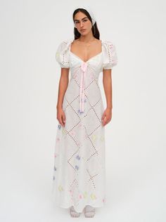 Chase rainbows in the whimsical Andrea white maxi dress—an embroidered dress inspired by the handkerchiefs you'd find while visiting grandma's house. This patchwork sundress features feminine short puff sleeves and eyelet lace trims. Eyelet Dress Outfit, Swedish Dress, Modest Girly Outfits, Vintage Sundress, Empire Waist Gown, Maxi Dress White, White Embroidered Dress, Grandma's House, Embroidered Maxi Dress