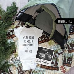 an image of a baby announcement on a blanket with the words, we're going to need a bigger tent