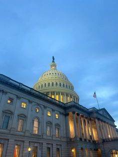 the capitol building is lit up at night