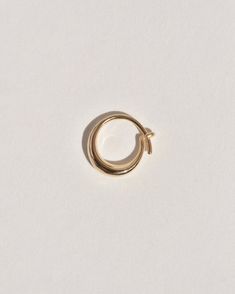 A semi-permanent style, the Sempre Hoop is part of a new offering of Leigh Miller that is designed to be worn everyday- or 'sempre'- which means always in Portuguese and Italian. This sculptural, solid gold hoop is intended to be put in, and never taken off. Wear it in the shower, in the pool or to sleep. Simply slide it in and fold the arm into its hook. Leigh was inspired to design this series to be the perfect huggers to compliment the rest of our sculptural earrings. The Sempre is ideal for Lobe Piercing, Gold Satin, The Shower, In The Pool, Fashion Help, Gold Hoop, The Pool, To Sleep, Statement Earrings