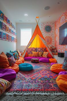 a room with lots of pillows and a teepee tent