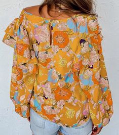 Effortlessly elevate your style with our Floral Ruffle Blouse in Yellow Multi. The vibrant yellow, gold, orange, pink, and blue floral print creates a bold statement, while the ruffle detailing adds a touch of femininity. The flowy ruffles over the shoulders and the elastic wrist cuffs on the puff sleeves add a charming touch to this fashionable piece. Size Guide Size US Bust Length Hem Width S 0-4 38.6 24.4 42.9 M 6-8 40.9 25.2 45.3 L 10-12 43.3 26.0 47.6 XL 14-16 46.5 26.8 50.8 Tuxedo Suit, Blue Floral Print, Wrist Cuffs, Gold Orange, Floral Ruffle, Orange Pink, Puff Sleeves, Boutique Clothing, Blue Floral