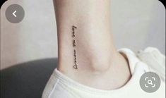 a small tattoo on the ankle that says, i love you and is written in cursive font