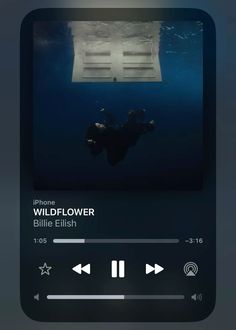 an iphone with the music player on it's screen