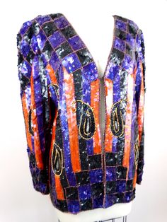 "This is a stunning statement piece! This evening jacket is fully embellished with sequins all over in a retro design. It's in excellent condition! Bust - 40\" (there is 1 hook closure) Shoulders - 16\" Sleeves - 24\" Top to Bottom - 27\" All of my items come from a smoke-free and pet-free home. If you have any questions, please don't hesitate to ask!" Festive Sequined Evening Outerwear, Festive Evening Outerwear With Sequins, Long Sleeve Embellished Outerwear For Party, Glamorous Beaded Party Outerwear, Vintage Festive Sequin Outerwear, Vintage Sequined Outerwear For Festive Season, Vintage Sequined Outerwear For Festive Occasions, Fall Embellished Fitted Sequin Fabric, Embellished Sequin Fabric For Fall Fitted Outfits