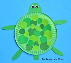 a paper plate turtle with green circles on it