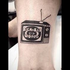 a black and white tattoo on the wrist of a person with an old fashioned tv