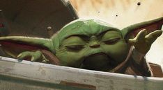 an image of a baby yoda in a box