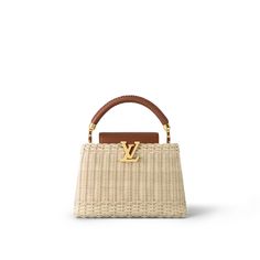 This Capucines BB handbag is made from hand-woven, natural rattan paired with calfskin on the flap and top handle. The rattan is first soaked in water to soften it, then shaped by the weaver, a process that takes about three hours. It's fitted with a thin removable and adjustable leather strap for shoulder or cross-body carry. 2023 Handbags, Tas Louis Vuitton, Louis Vuitton Capucines Bb, Sac Louis Vuitton, Louis Vuitton Collection, My Style Bags, Louis Vuitton Capucines, Luxury Bags Collection, Shoes Heels Classy