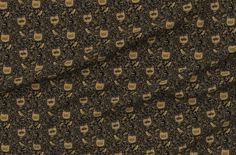 an image of a brown and black pattern with gold skulls on the front, along with other patterns