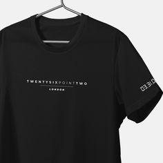 a black t - shirt with the words twenty six twenty two london printed on it