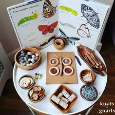 a table topped with lots of different types of items on top of a white table