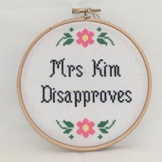 a cross stitch pattern with the words mrs kim disapprovings