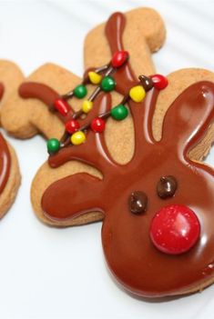 some cookies decorated like reindeers with candy on them