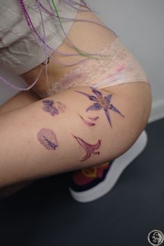 a person with tattoos on their legs