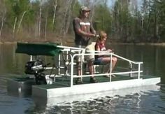 a man and two children are on a pontoon in the middle of a lake