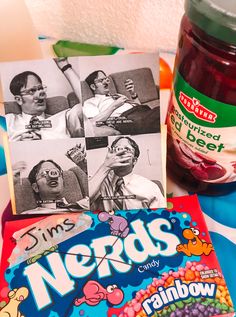 there are candy, gummy bears and a jar of jelly beans on the table