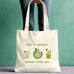 Elevate your everyday style with our  everyday tote bag for matcha lovers! Made from durable, eco-friendly materials, this charming tote is perfect for carrying your essentials in a fun and stylish way.  If you love traveling to Japan, love their culture, or just want a minimalist tote bag, this is for you.  Whether you're a traveler, a busy student, or a grocery shopper, this tote adds a dash of positivity to your day. Perfect for matcha enthusiasts, eco-conscious shoppers, and stylish students Green Kawaii Shoulder Bag For Daily Use, Kawaii Green Shoulder Bag For Daily Use, Green Canvas Bag With Letter Print For Everyday, Green Everyday Kawaii Shoulder Bag, Casual Canvas Bag With Eco-friendly Ink For Daily Use, Eco-friendly Green Bag With Letter Print, Eco-friendly Green Bags With Letter Print, Aesthetic Matcha Latte, Japanese Kawaii Fashion