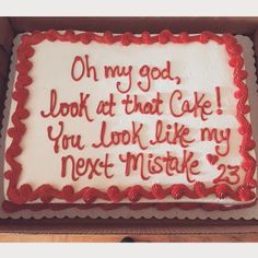 a sheet cake with red icing in a box that says oh my god look at that cake you look like my next mistake