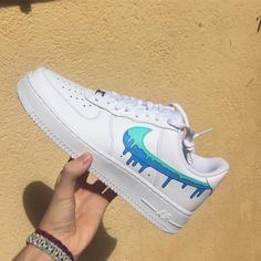 Be bold in your expression and take risks in style with the Green Blue Drip Custom Air Force 1s. Proudly display the one-of-a-kind design on a canvas that’s as classic as they come. 🎨 Exactly as shown in the pictures. 📷 Brand New & Authentic. 💯 Hand Painted with attention to detail. 👨‍🎨 Waterproof and Flexible. ❤️ Unisex model. Please refer to the Size Chart. 👟👫 Free Worldwide Shipping. ✈️🌍 Artistic Blue Custom Sneakers With Waterproof Paint, Blue Custom Artwork Sneakers, Artistic Blue Custom Sneakers For Streetwear, Artistic Custom Blue Sneakers For Streetwear, Blue Waterproof Custom Sneakers For Sports, Customizable Blue Sneakers For Streetwear, Artistic Blue Sneakers With Custom Artwork, Artistic Blue Sneakers For Streetwear, Casual Blue Custom Sneakers With Paint Splatter