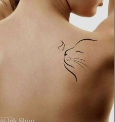 a woman with a cat tattoo on her back