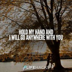 two people sitting under a tree with the words hold my hand and i will go anywhere with you