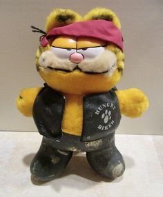 a yellow and black stuffed animal wearing a bandana