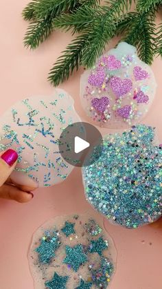 three different colored glitters are being used to make christmas ornaments