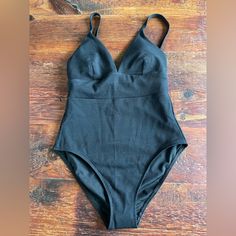 Arezzo V-Neck Panel Swimsuit Nwt Black V-neck Swimming Bodysuit With Built-in Bra, Black V-neck Bodysuit For Sunbathing, Black V-neck Bodysuit With Built-in Bra, Black V-neck Bodysuit For Beachwear, Black Seamless V-neck Swimwear, Black V-neck Bodysuit For Swimming, Black V-neck Elastane Swimwear, Black V-neck One Piece Beachwear, Tie Swimsuit