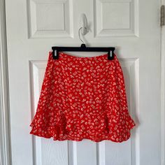 Beautiful Floral Mini Skirt With A Ruffled Hem. New With Tags! Skirt Is Lined And Has A Zipper In The Back. Perfect For Summer! Open To Reasonable Offers! Red Fitted Skort For Spring, Fitted Red Skort For Spring, Red Relaxed Skort For Summer, Red Skort For Summer, Red Relaxed Fit Skort For Summer, Spring Red Tiered Skirt, Red Flowy Mini Skirt For Spring, Red Lined Skort For Spring, Red Ruffled Mini Skirt For Summer