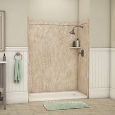 a bathroom scene with focus on the bathtub and shower stall, along with rugs