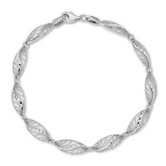 She’ll love the vintage charm of this romantic link bracelet. Crafted in 14K white gold, this fanciful style features diamond-cut marquise-shaped links adorned with an open-worked swirling pattern and intricate milgrain detailing. Buffed to a brilliant luster, this sentimental 7.25-inch look secures with a lobster claw clasp. Swirl Pattern, White Metal, Bracelet Designs, Vintage Charms, The Vintage, Lobster Claw, Link Bracelets, Fashion Bracelets, Types Of Metal