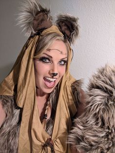 a woman dressed as a wolf with her mouth open