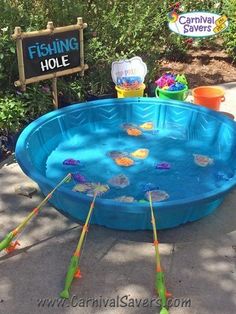 an inflatable swimming pool with fishing holes on the bottom and sticks sticking out of it