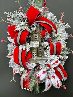 a christmas wreath with a house on it