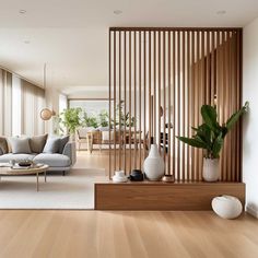 a living room filled with furniture and wooden slats